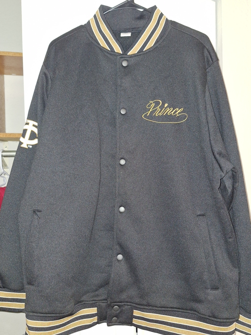Prince Black and Gold Varsity Jacket with Script Logo